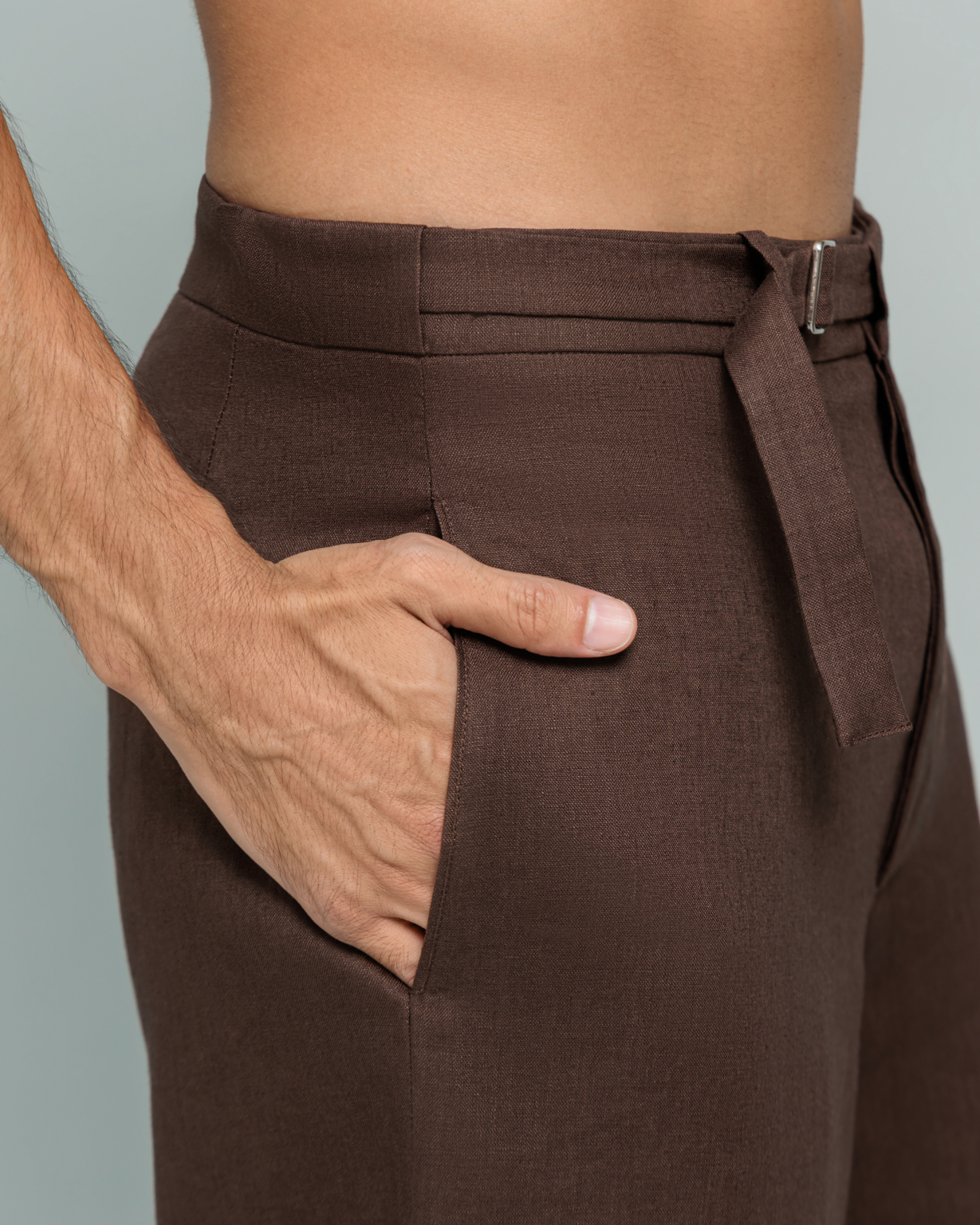 Close up detail of ROOT TROUSER waist buckle and pocket, Desert Dusk brown 100% linen, 20Two Elemental GHAF capsule