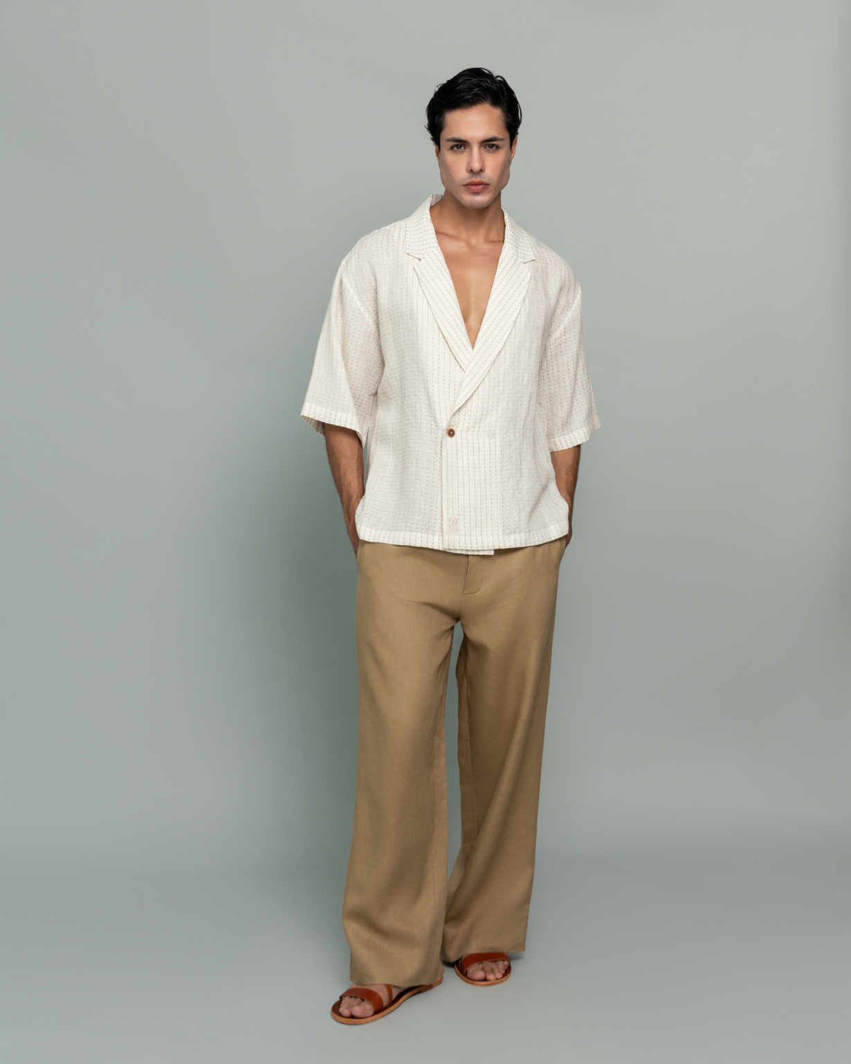 20Two Elemental SHADE OVER-SHIRT in Ivory Dune Stripe worn open over GRAIN TOP and ROOT TROUSER in Sand Dune, front view