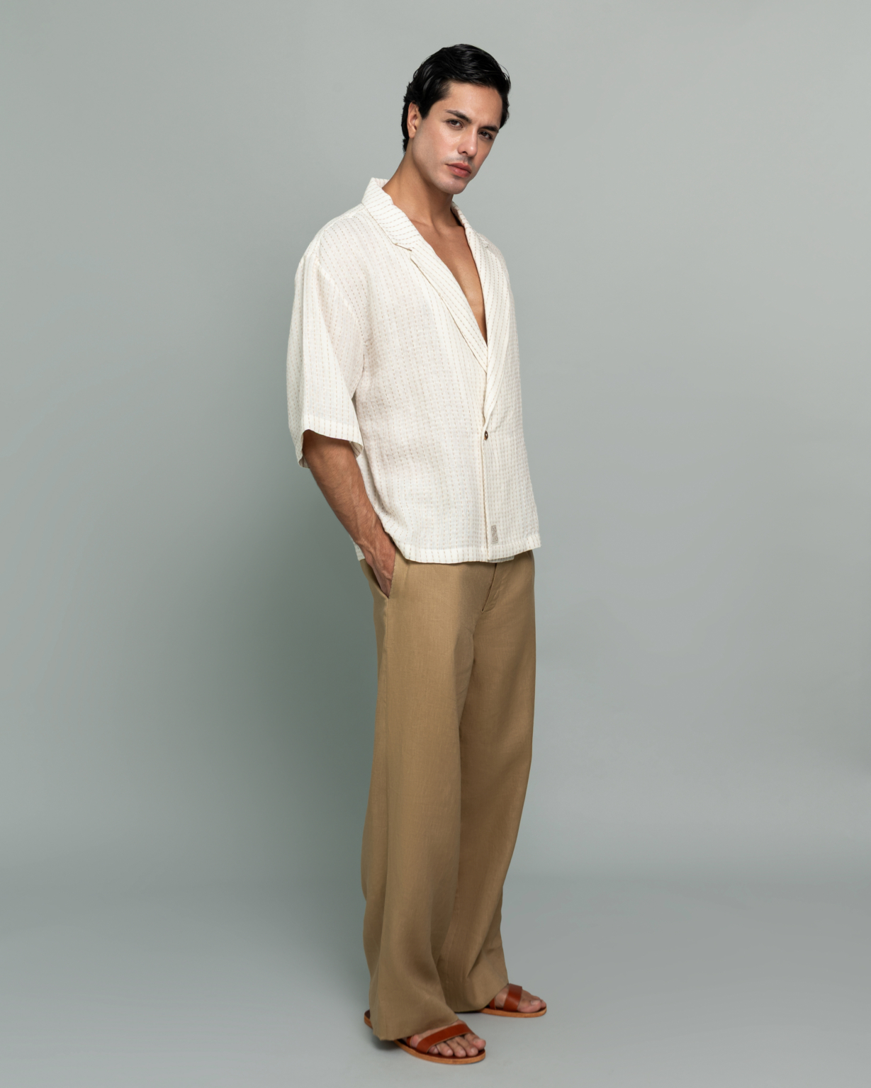 20Two Elemental SHADE OVER-SHIRT in Ivory Dune Stripe worn open over GRAIN TOP and ROOT TROUSER in Sand Dune, front standing view