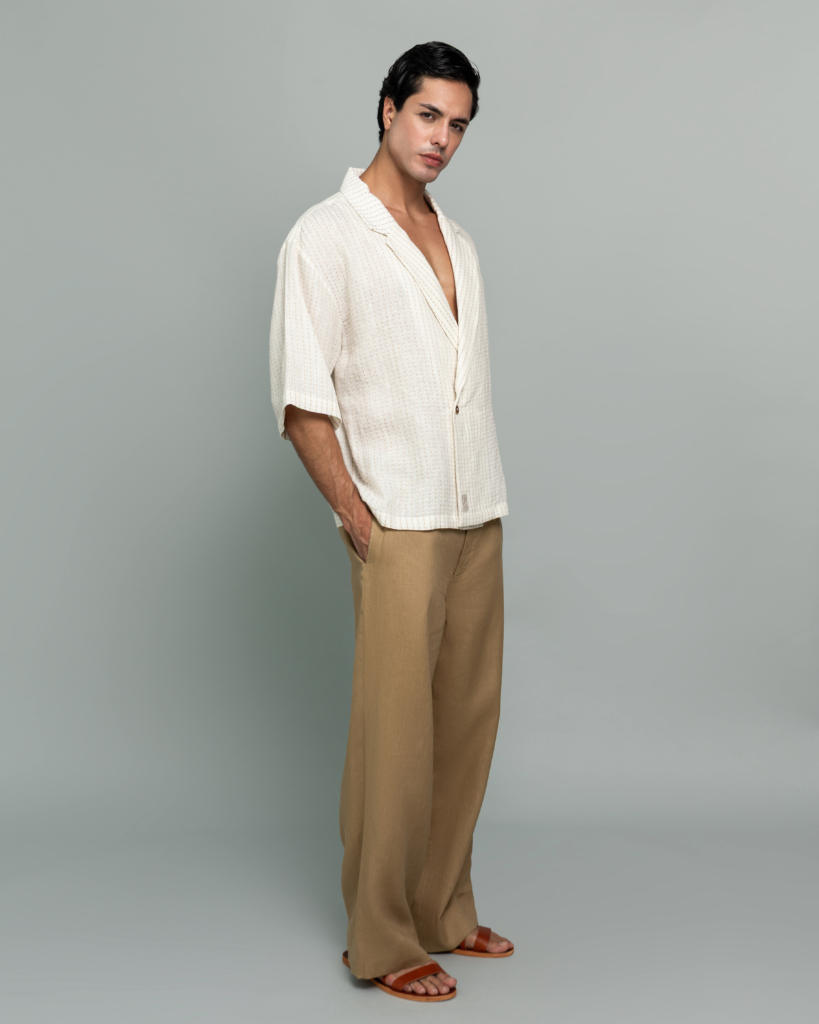 20Two Elemental SHADE OVER-SHIRT in Ivory Dune Stripe worn open over GRAIN TOP and ROOT TROUSER in Sand Dune, front standing view