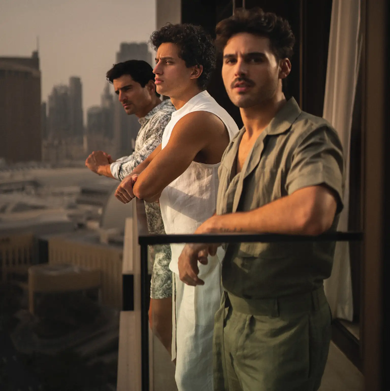 20two elemental impact, giving back to nature, purpose stylish guys on balcony of dubai downtown