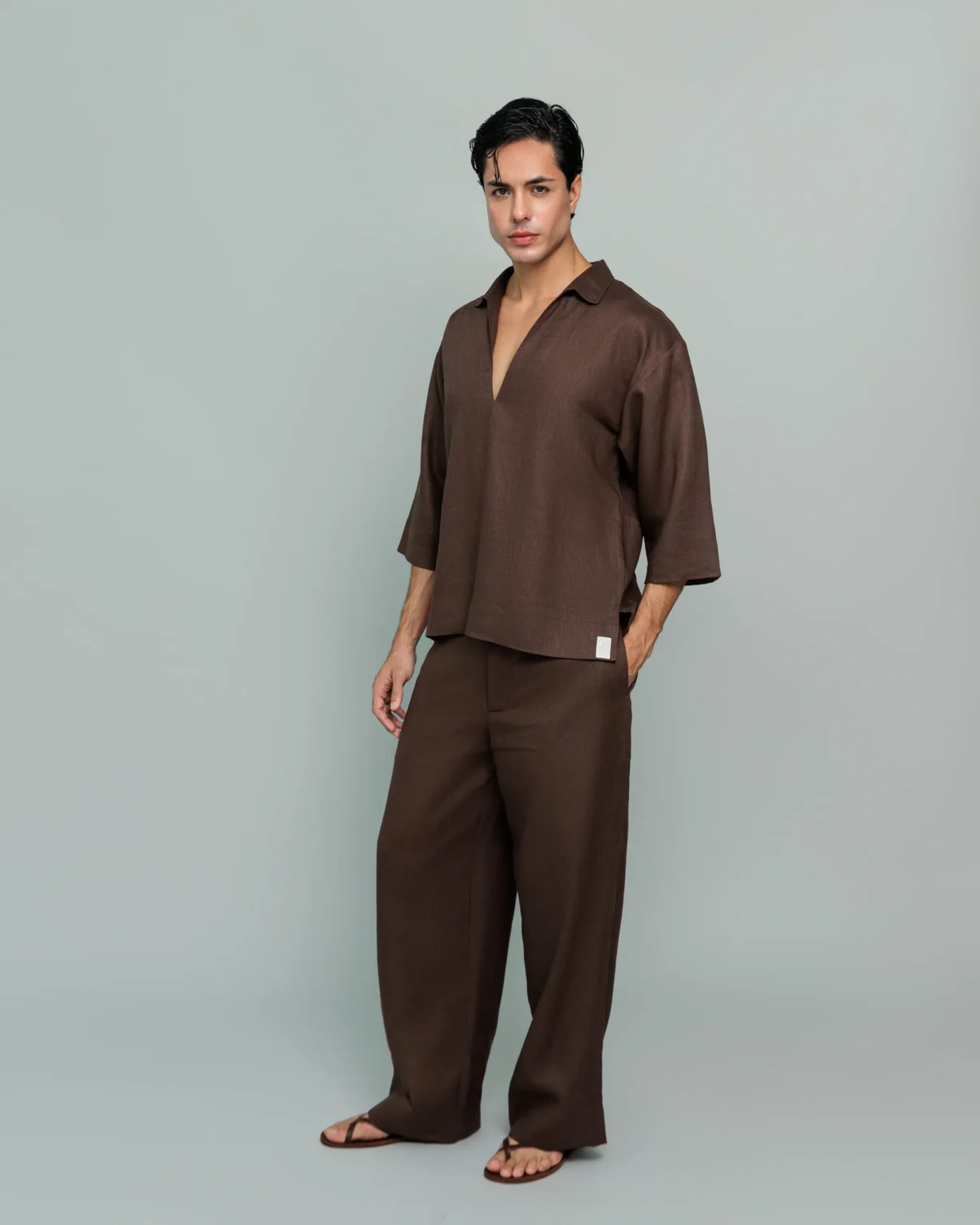 Man wearing 20Two Elemental's GHAF grain-top and rooted trouser set in brown, three-quarter front view