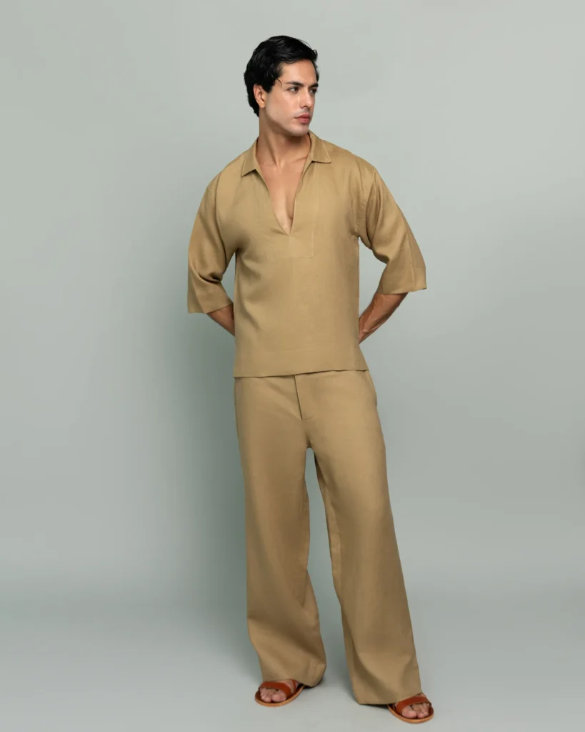 Man wearing 20Two Elemental's GHAF grain-top and rooted trouser set in desert tan, relaxed v-neck top with dropped shoulder, front view