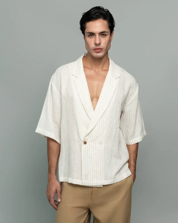 Man wearing 20Two Elemental's GHAF ivory over-shirt in a subtle stripe weave with a desert tan drift short, front medium view