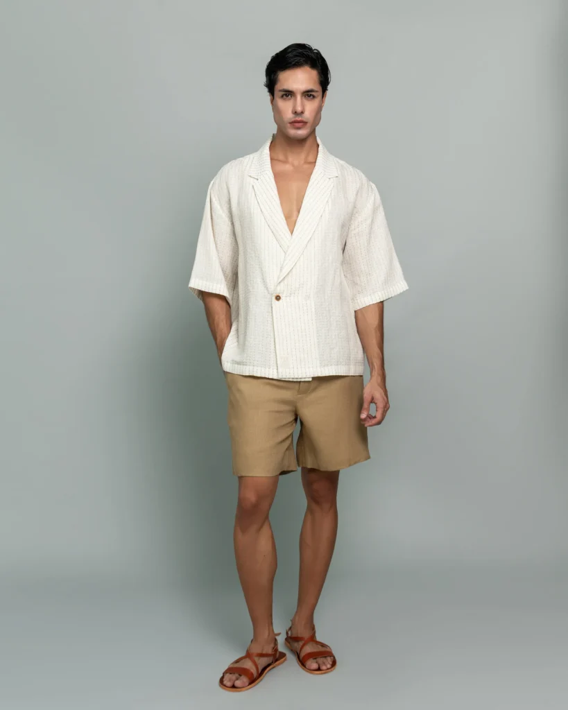 Man wearing 20Two Elemental's GHAF ivory over-shirt and desert tan drift short, front view