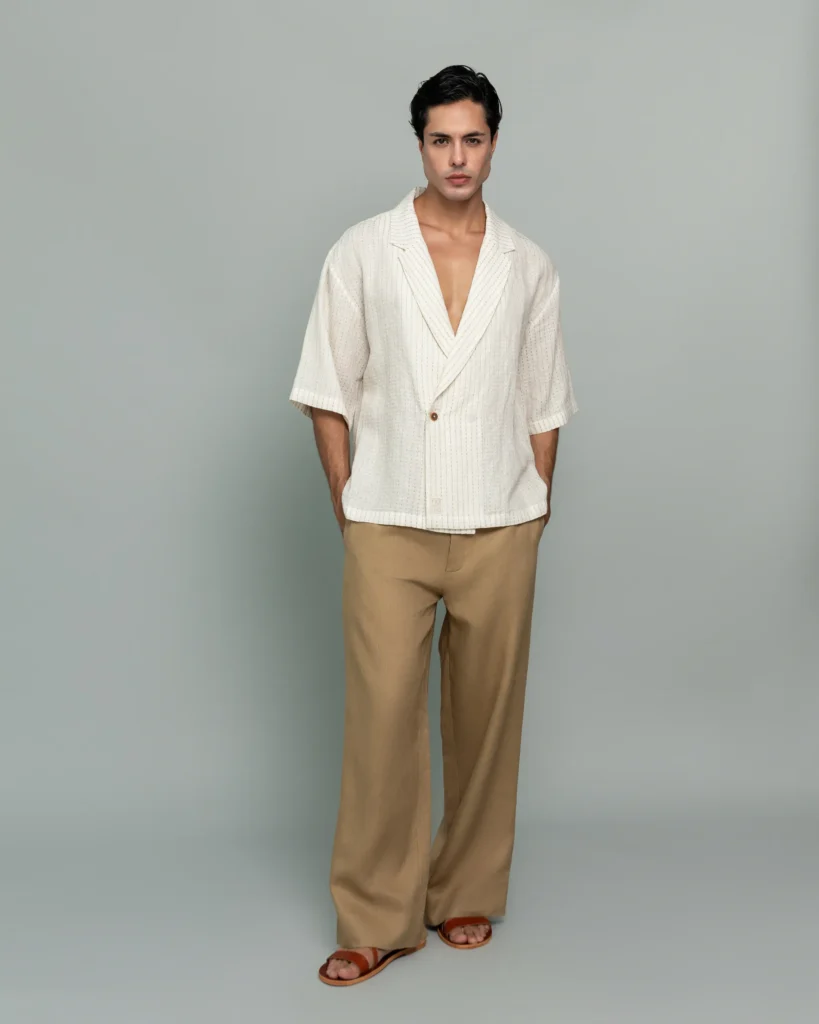 Man wearing 20Two Elemental's GHAF ivory over-shirt in a subtle stripe weave with a desert tan rooted trouser, double-breasted front, front view