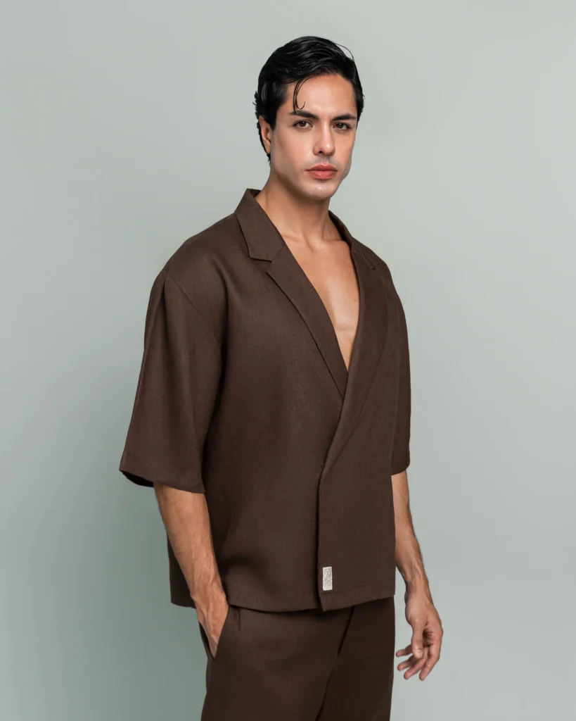 Man wearing 20Two Elemental's GHAF over-shirt and drift short set in brown, wrap-front shawl collar jacket, front view