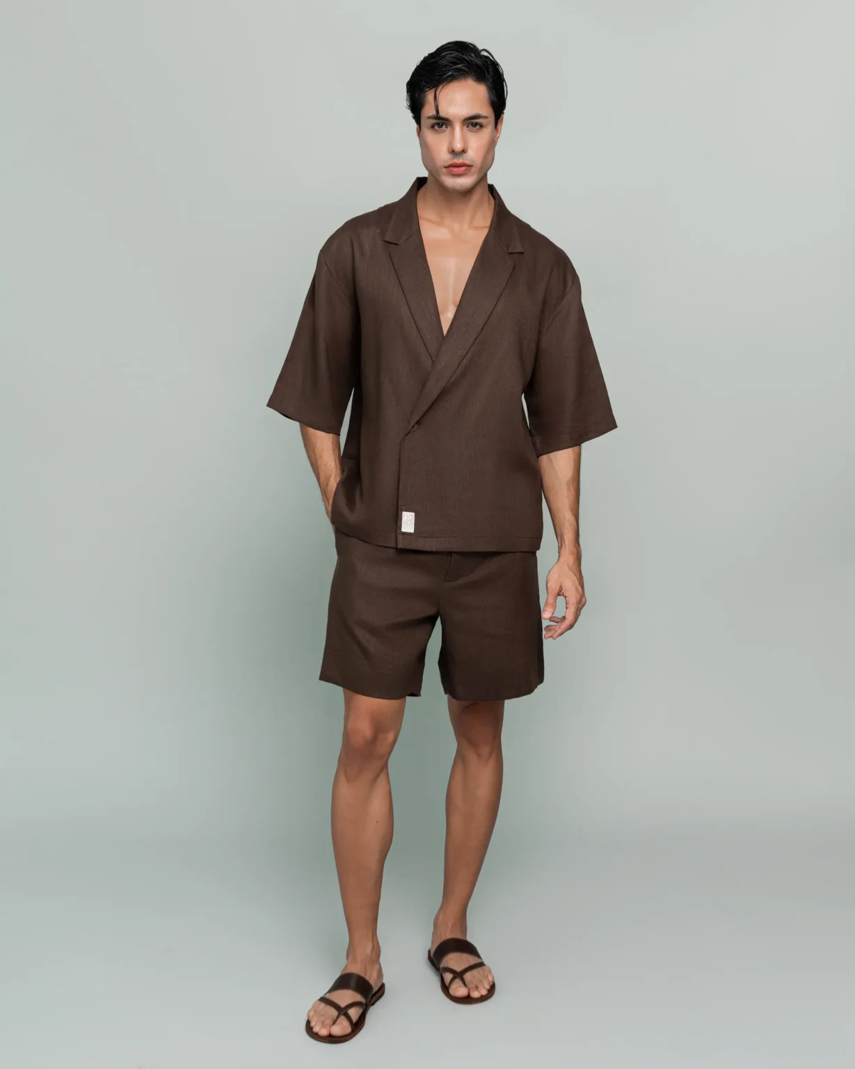 Man wearing 20Two Elemental's GHAF over-shirt and drift short set in brown, front view, calm studio atmosphere